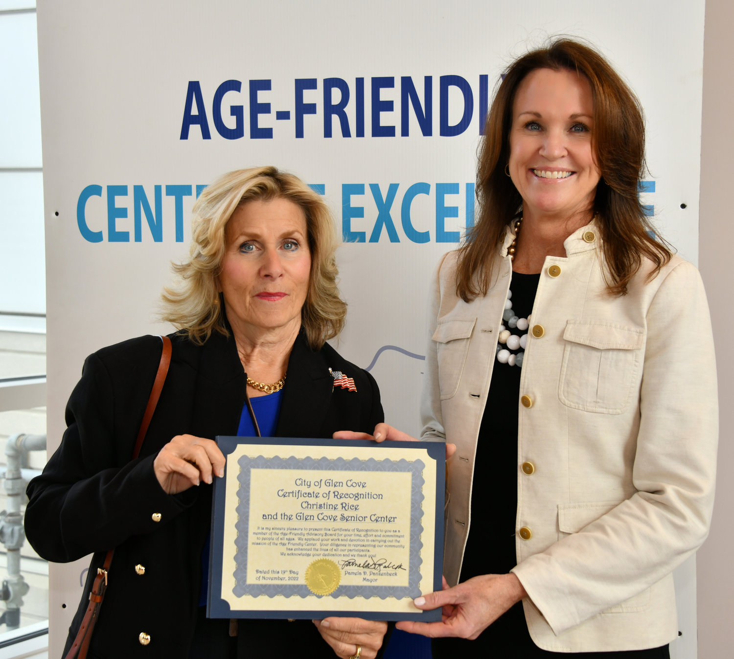 Mayor Pamela Panzenbeck, left, presented a citation to Christine Rice, executive director of the Glen Cove Senior Center for her role in making the city welcoming for seniors.